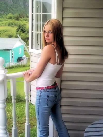 Dee - standing on a balcony