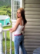 Dee - standing on a balcony