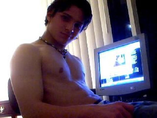 Alex Barba - No shirt on.  Nude from the waste up.